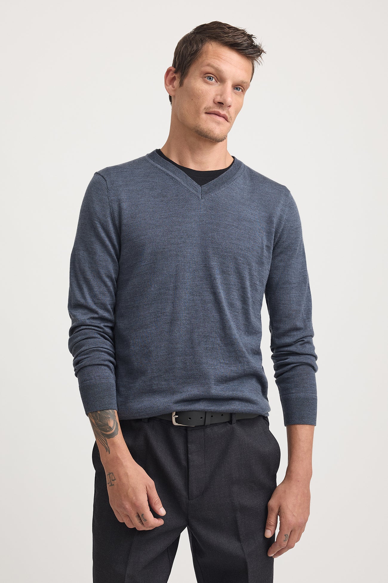 This style has a neat yet classic fit designed to be worn over a tshirt.  We recommend taking your usual size or choosing 1 size up if you prefere a more relaxed fit and room for layering over a shirt.  Our model is wearing a size M. Chest Width for size M is 52cm. Add 2.5cm for each size. Garment Length for size M is 71cm. Add 1cm for each size.